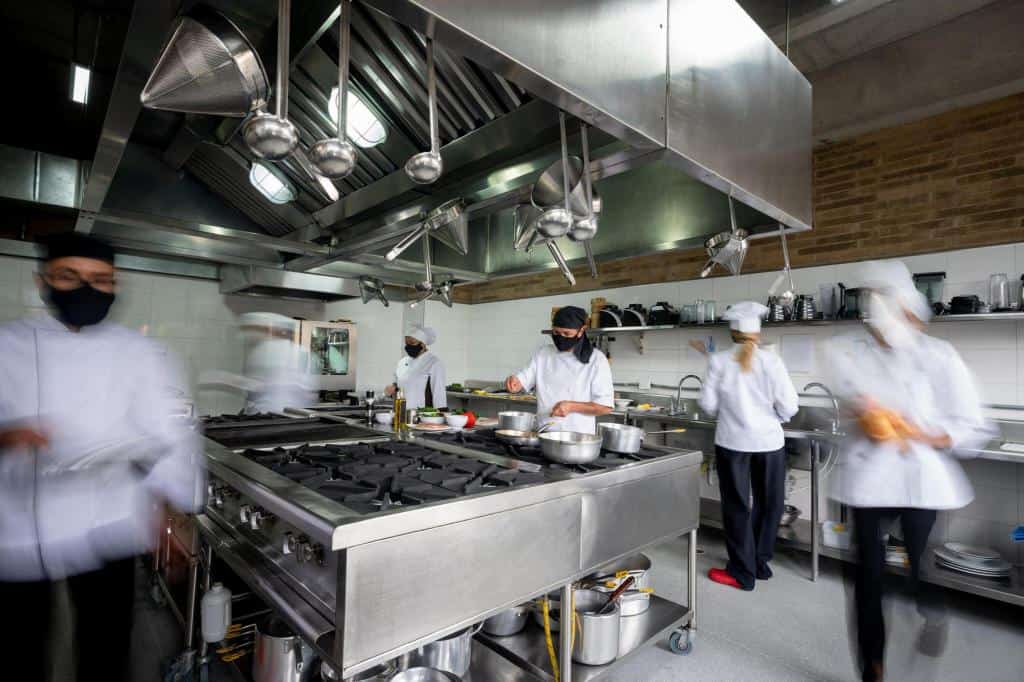 chef working in a kitchen layout