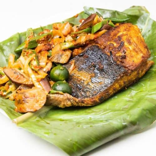 Grilled Stingray Fish With Spices and Vegetable Served on Banana Leaf - Recipe