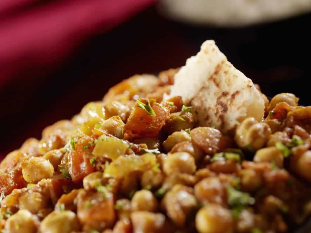 chana masala, an indian vegetarian dish with chickpeas and naan bread 2