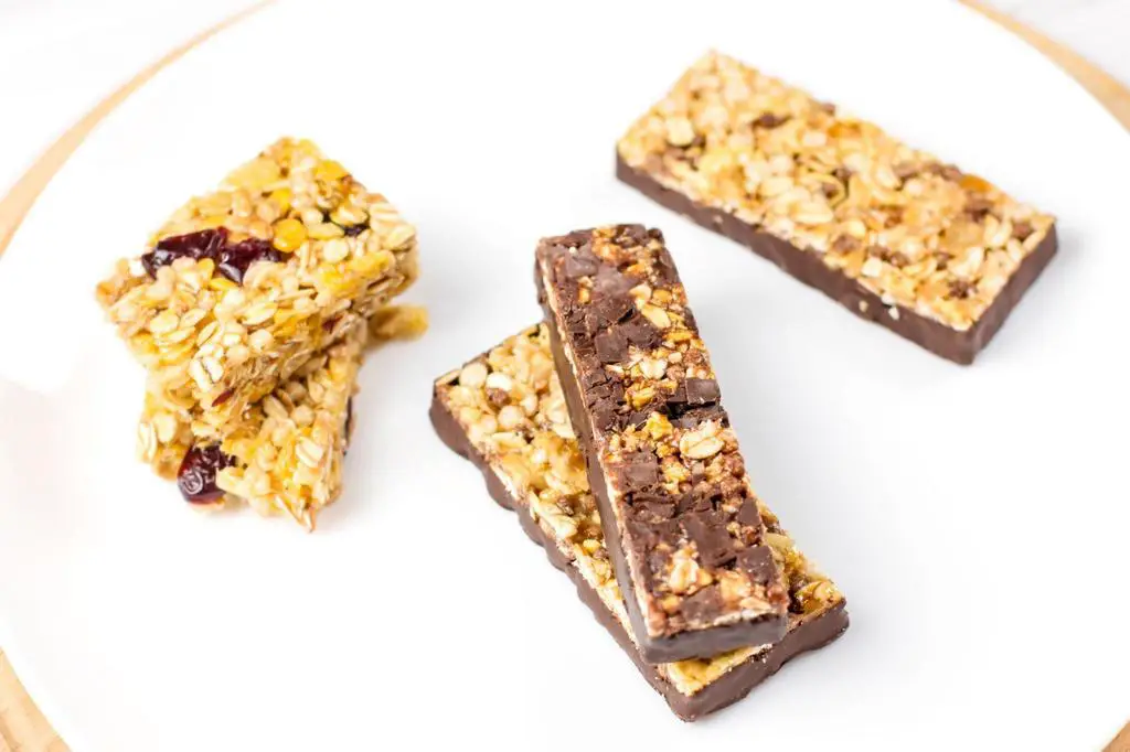 chocolate fruits and berries granola bars on plate