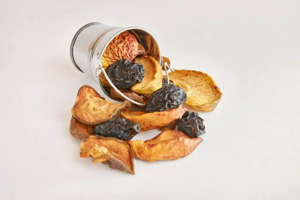 many dried fruits in a metal mini bucket