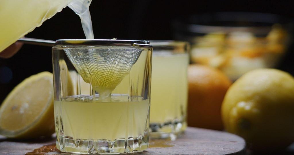 preparing homemade orange lemonade