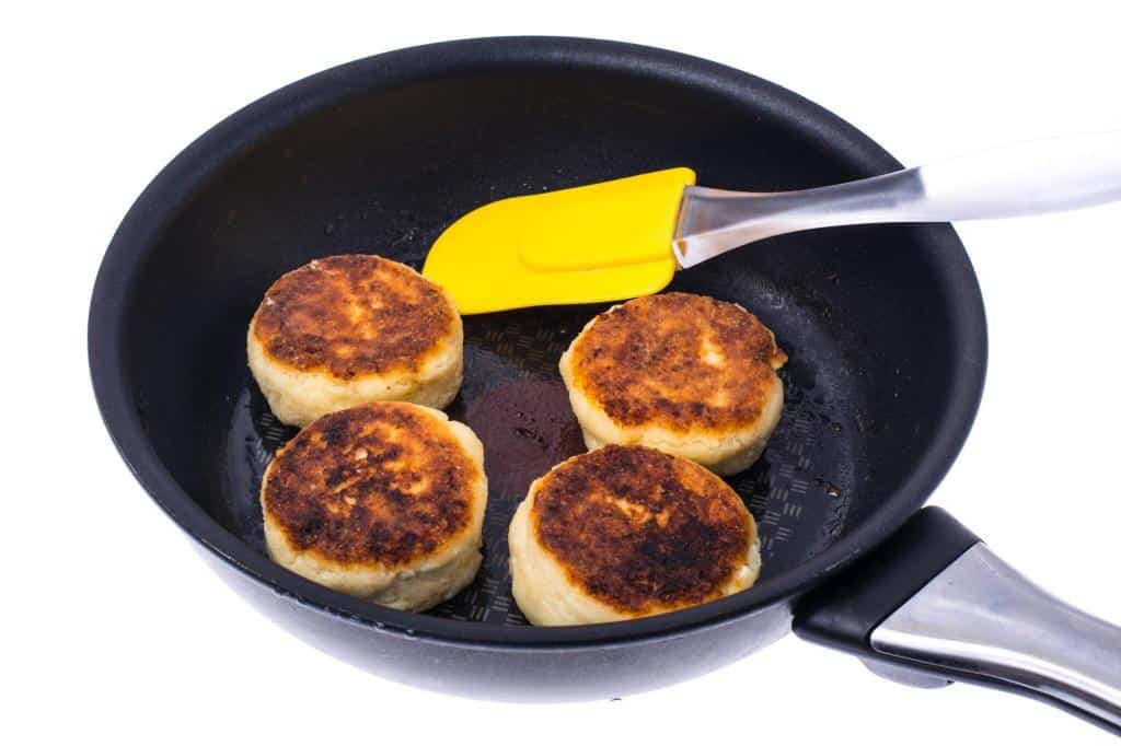 fried cheese cakes in frying pan