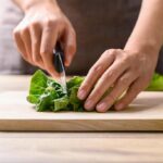 cutting green lettuce