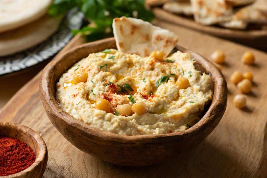 homemade chickpea hummus-with pita chips and paprika