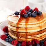 pancakes with berries and maple syrup