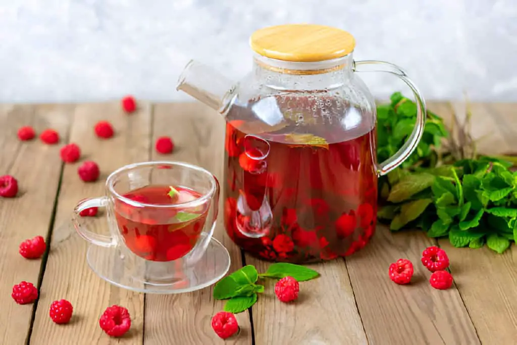 herbal tea with berries raspberries-mint-leaves-and-hibiscus-flowers
