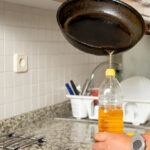 placing recycled edible oil from a frying pan