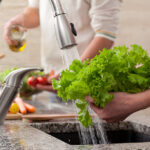 washing vegetables lettuce for a salad