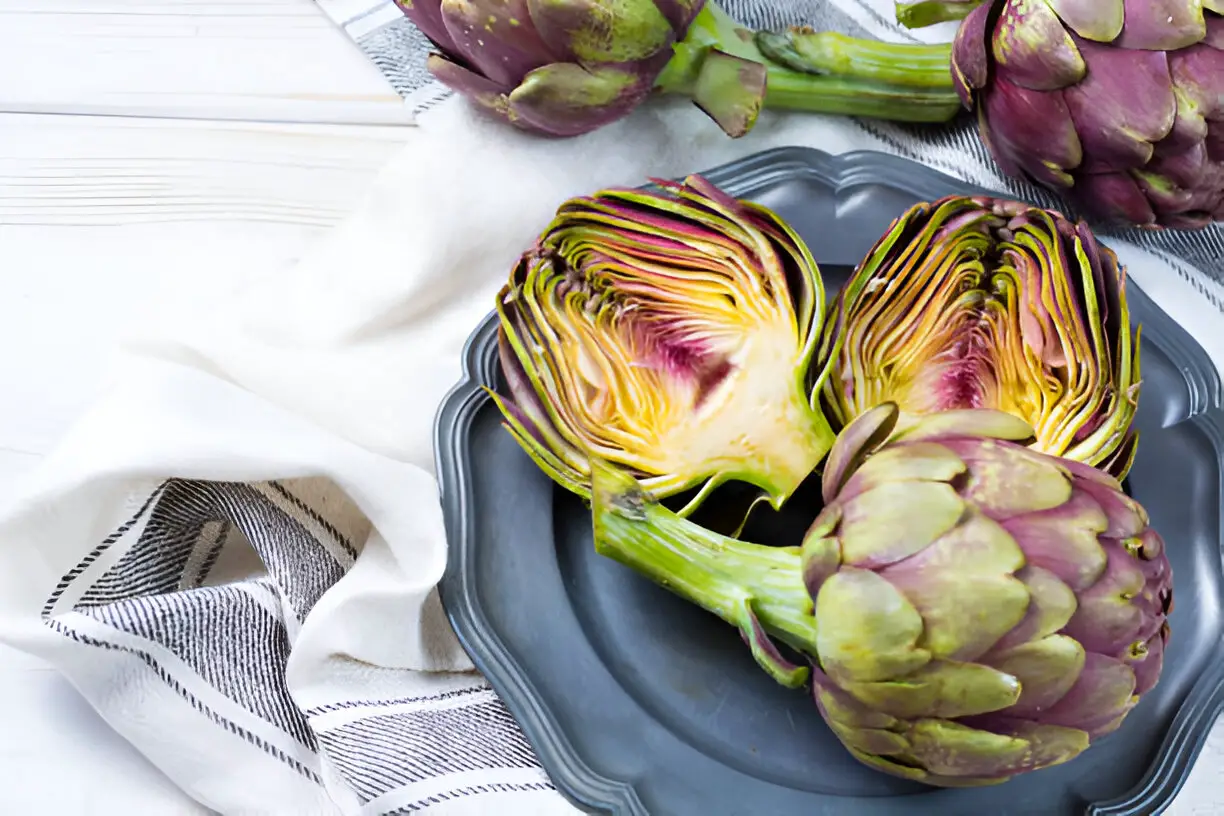 fresh big romanesco artichokes green purple flower heads ready to cook