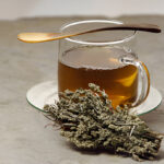 glas of herbal tea with mugwort