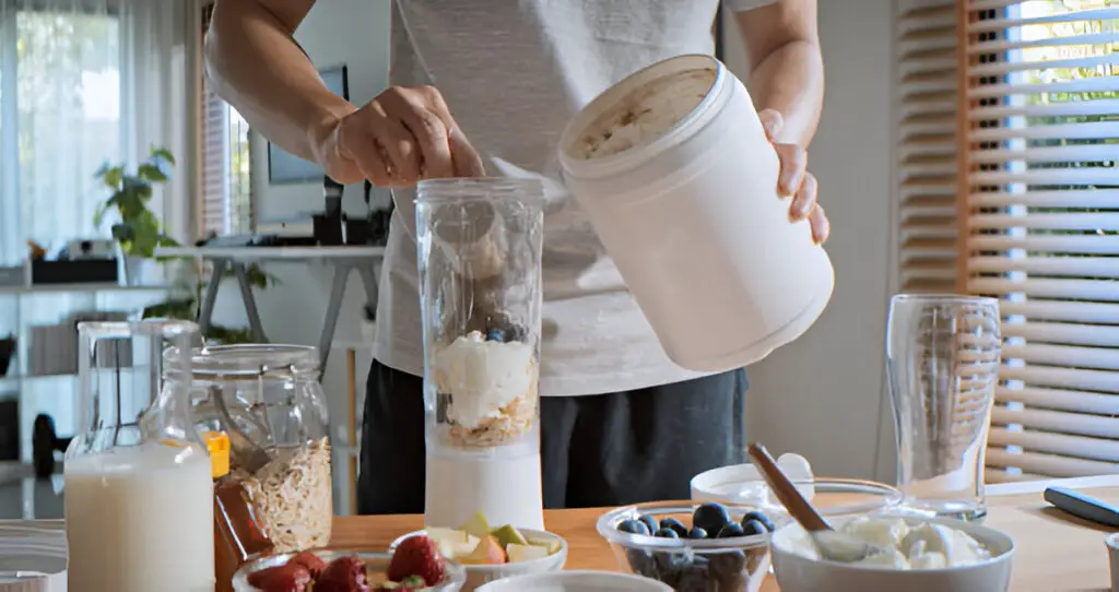 prepare and make protein shake drink mixed fruit