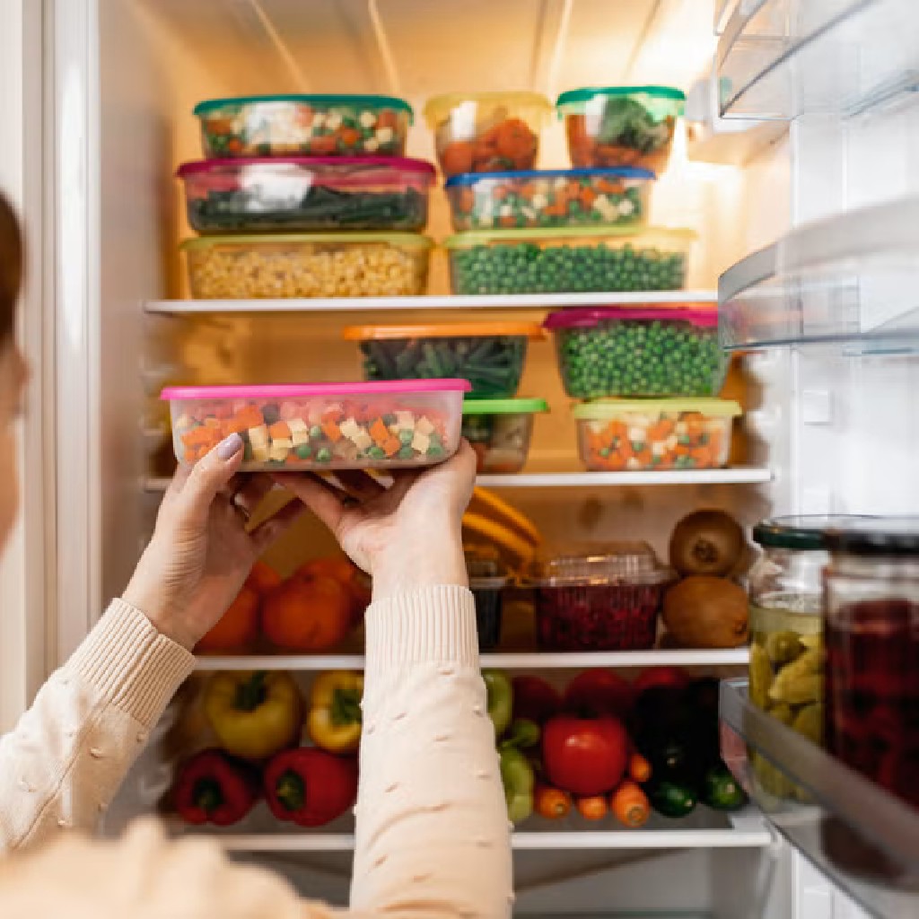 taking raw food from refrigerator