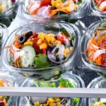 boxes with pre packaged-vegetable-salads in a commercial fridge