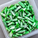 frozen green beans in a plastic-container-for-long-term storage deep freezing