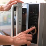 microwave oven door and preparing food in microwave