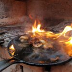 mushrooms in frying pan on fire