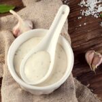 bowl of garlic sauce or mayonnaise
