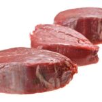 three raw steaks bottom round