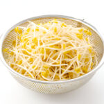 fresh soybean sprouts in stainless steel colander