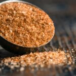 cajun seasoning spilled from a teaspoon