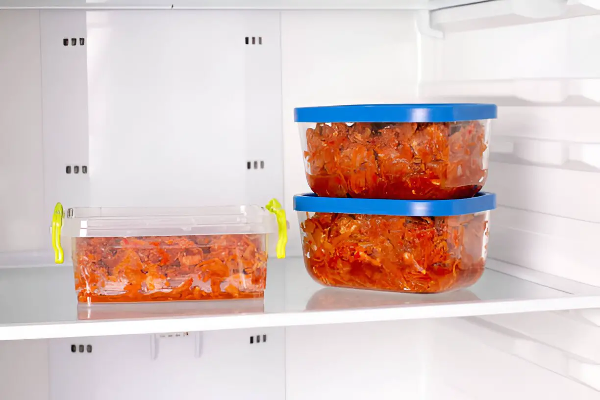 frozen stewed cabbage in a-container in the refrigerator